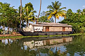 Kerala backwaters, our three hours neighborhood tour in the narrow canoe towards Vembanad Lake and along one of the  narrow canal running near our guest house at Kumarakom. 